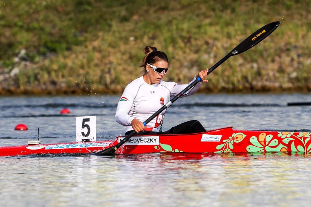 Erika Medveczky racing in her red kayak